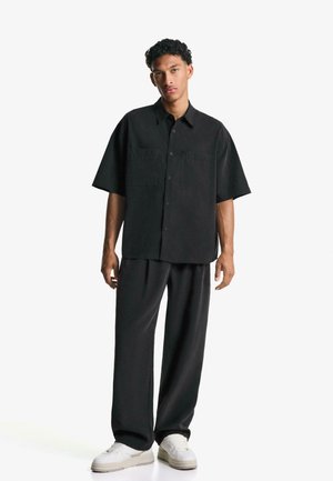 Bershka JOGGER - BAGGY - Bukser - black