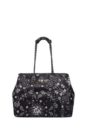 Sac cabas noir avec motifs floraux et cachemire blancs, longues anses avec détail noué, et nom de la marque "ROXY" au centre.