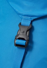 Blue fabric with a textured finish featuring a black plastic buckle and adjustable strap. The buckle is embossed with the brand "deuter."