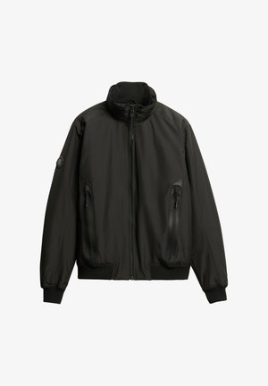 Zwarte zip-up jack met een hoge kraag, gestructureerd oppervlak, ribgebreide manchetten en twee rits-zijzakken. Gevuld met een ronde logo op de mouw.