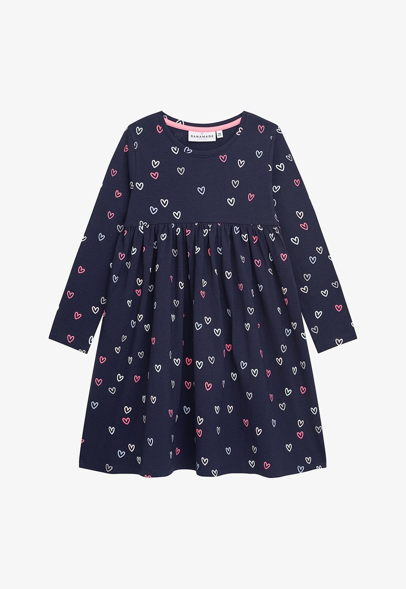 Marineblaue Langarmkleid mit Empire Taille, das ein verstreutes Herzmuster in Rosa, Weiß und Hellblau aufweist. Hergestellt aus weicher Baumwolle.
