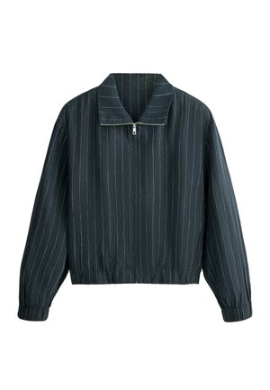 Veste noire à fermeture éclair avec fines rayures verticales blanches, manches longues, poignets élastiques et large col.