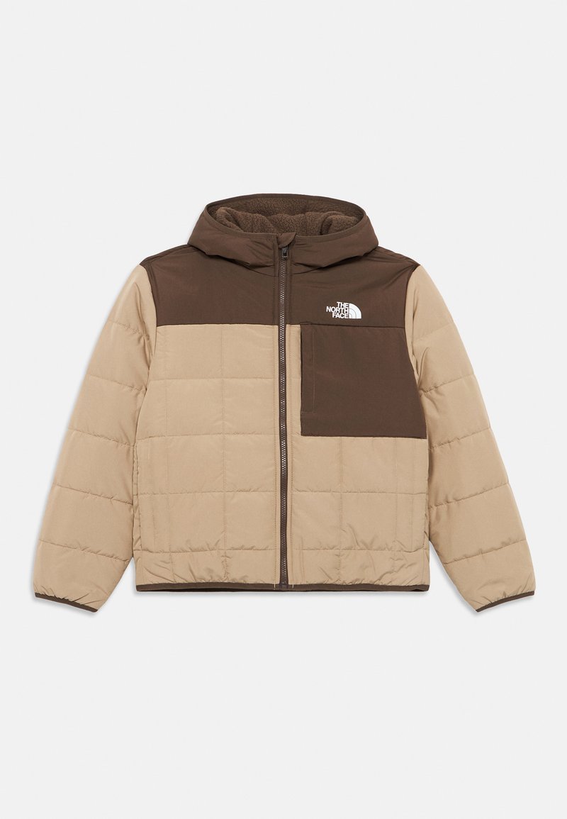 Nafukovacia bunda v béžovej a hnedej farbe so zipsom vpredu, kapucňou a vyplneným prešívaním. Obsahuje vrecko na hrudi a logo The North Face na hornej ľavej strane.