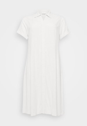 White linen shirt dress with a collar, short rolled sleeves, and front button closure. Features a relaxed fit and knee-length hem.