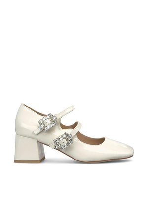 Scarpe Mary Jane in vernice bianca con punta quadrata, tacco basso a blocco e due cinturini decorati con cristalli sul collo del piede.