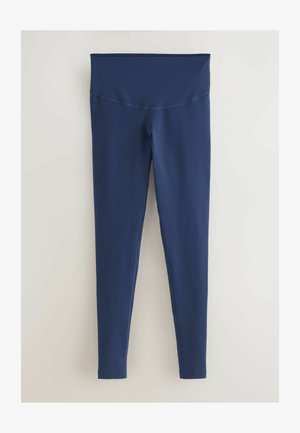 Granatowe legginsy wykonane z elastycznego materiału, z szerokim, gładkim pasem i dopasowanym krojem. Brak wzorów lub wyraźnych akcentów.
