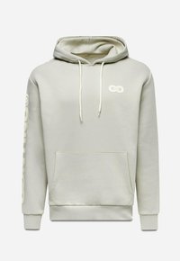 Sweat à capuche beige clair avec poche kangourou à l'avant, capuche avec cordon, poignets côtelés, petit logo chaîne liée sur la poitrine et grand texte sur la manche.