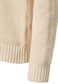 Kremowy sweter dzianinowy z fakturowanym wzorem, z prążkowanymi mankietami i dolnym brzegiem. Miękki materiał, przytulny i przewiewny design.