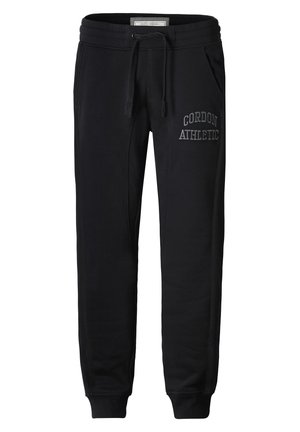 Black sweatpants made of soft fabric, featuring a ribbed waistband, drawstring, and "CORDON ATHLETIC" embroidered in gray on the side.