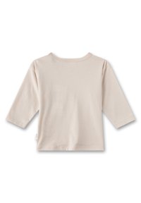 Langarmshirt aus hellem Beige in Baumwolle, mit rundem Ausschnitt und schlichter Gestaltung. Glatte Textur ohne sichtbare Muster oder Akzente.