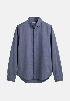 Blauwe chambray overhemden met lange mouwen, knoopsluiting op de kraag, witte knopen, een afgeronde zoom en een klein geborduurd logo op de borst.