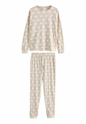 Beige pyjamastel met een lange mouwen-top en een elastische taillebroek, beide met kleine witte pompoenpatronen. Zacht katoenen materiaal.