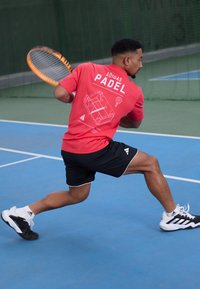 adidas Performance PADEL CAT GRAPHIC TEE - Sports T-shirts - semi lucid red