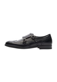 Scarpa da uomo in pelle nera con doppia fibbia, dettagli brogue sulla punta, forma arrotondata e tacco basso. Texture liscia nel complesso.