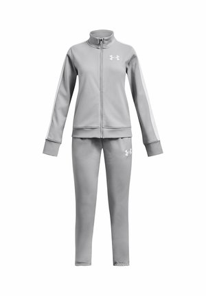 Survêtement de sport gris clair avec veste à zip intégral et pantalon assorti, arborant des logos Under Armour sur la poitrine et la cuisse.