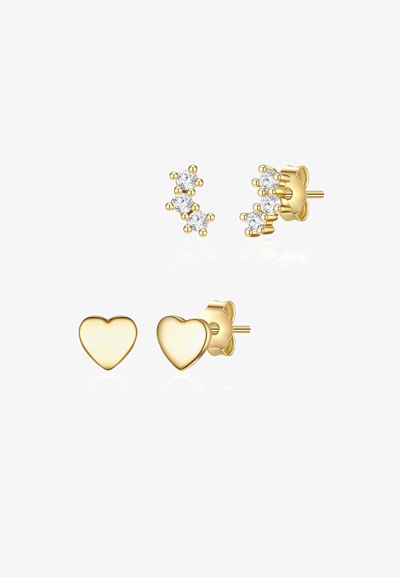 Stud naušnice u zlatnoj boji s oblikom srca i skupinom tri prozirna kristala. Glatka tekstura s poliranim završetkom.