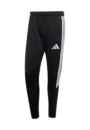 Pantalon de sport noir avec une ceinture élastique, comportant trois bandes verticales blanches sur le côté et un logo blanc sur la partie inférieure de la jambe.