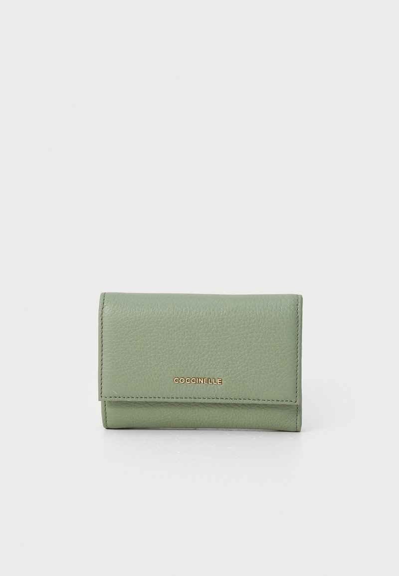 Green leather wallet with a textured surface, snap closure, and a gold logo. Compact rectangular shape.