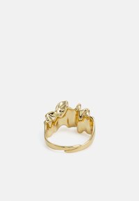 Gold-toned ring with a wavy, textured design featuring leaf-like accents; open band for adjustable fit.