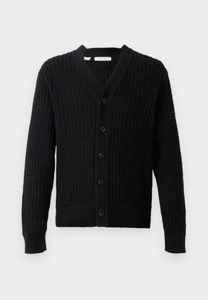 Black knitted cardigan with a textured pattern, V-neck, and six front buttons. Ribbed cuffs and hem enhance the overall design.