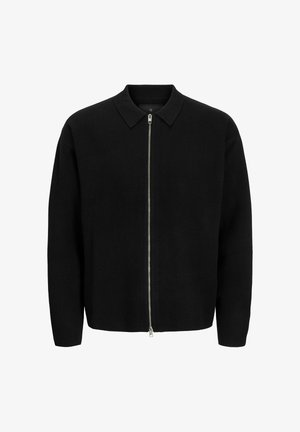 Mustmustööbiga must pika varrukaga tõmbluku-sviiter, millel on hõbedane eesmine tõmblukk, esitatud valgel taustal.