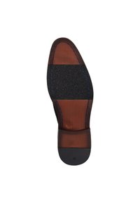 Semelle intérieure brune et noire avec des motifs texturés, talon en caoutchouc, couture contrastée, taille étiquetée 42, avec un motif en grille.