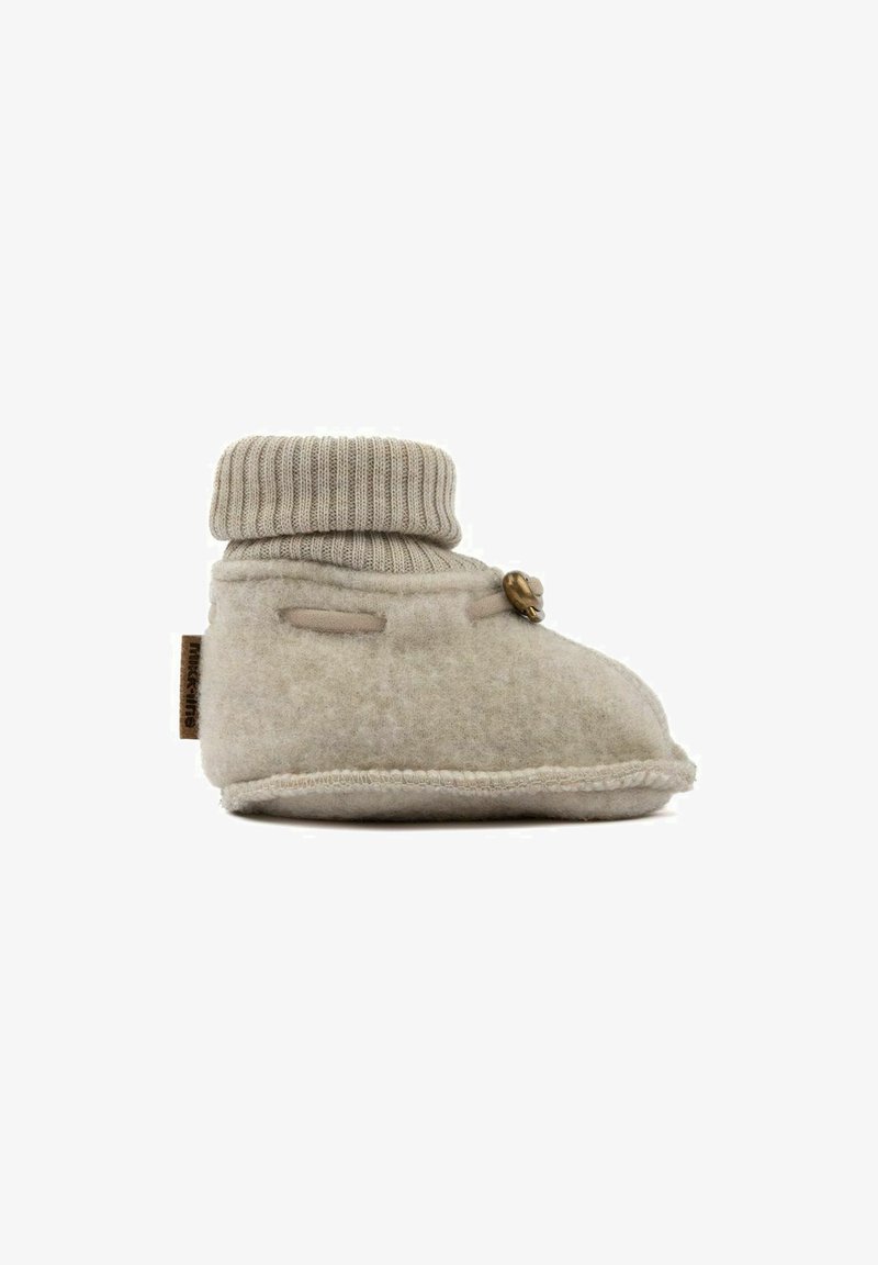 Felt baby bootie in light beige with a ribbed wool cuff, rounded shape, side button detail, and stitched edges for texture.