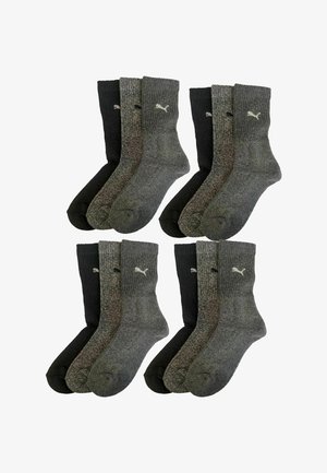 Vier Paar Socken mit einem gerippten Design, zwei in Dunkelgrau, zwei in Schwarz, mit einem dezenten Logo-Akzent in Weiß.