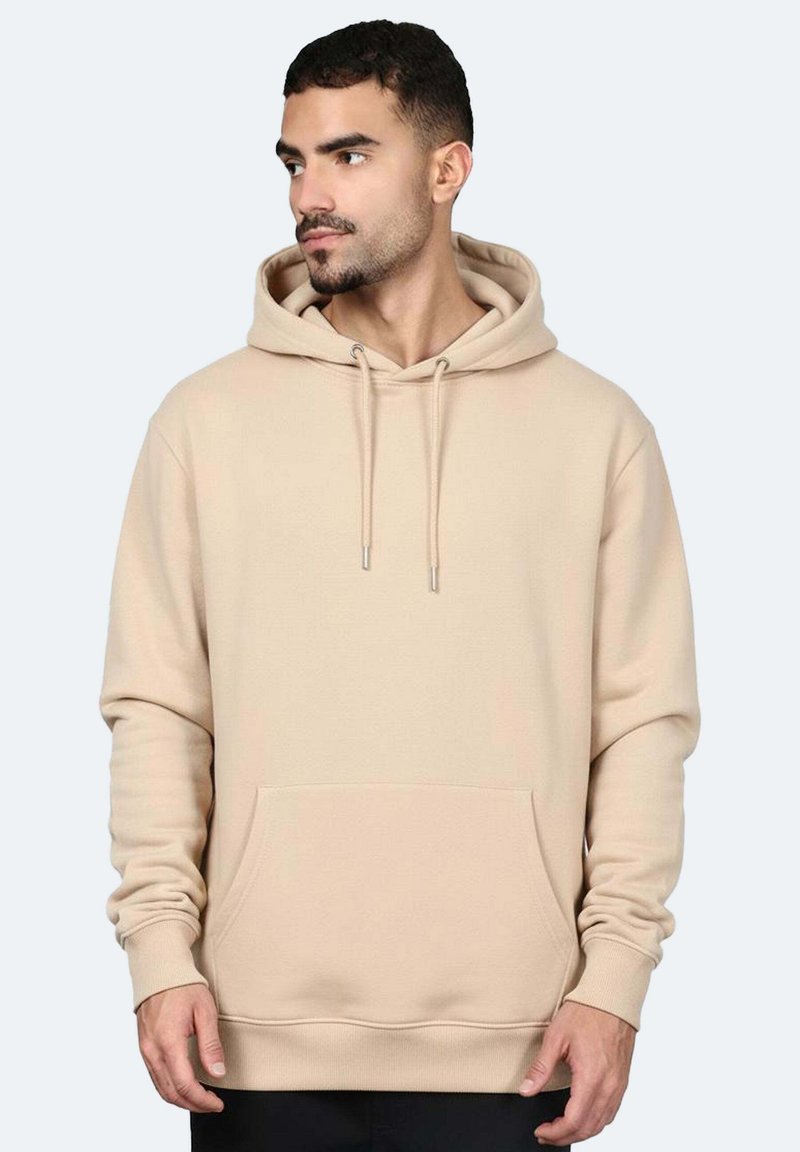 Felpa color beige con cappuccio, dotata di tasca a marsupio frontale, cordoncino regolabile e polsini a coste. Il tessuto appare morbido e liscio al tatto.