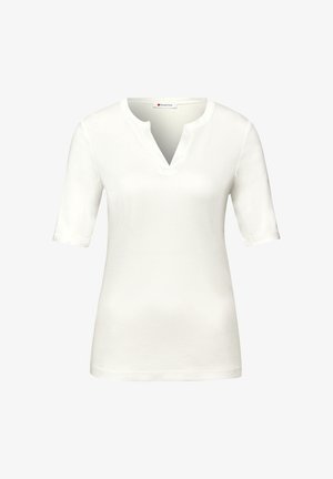 Chemisier blanc à manches courtes pour femme avec un col rond à encoches en V, réalisé en tissu lisse, présenté sur un fond uni.