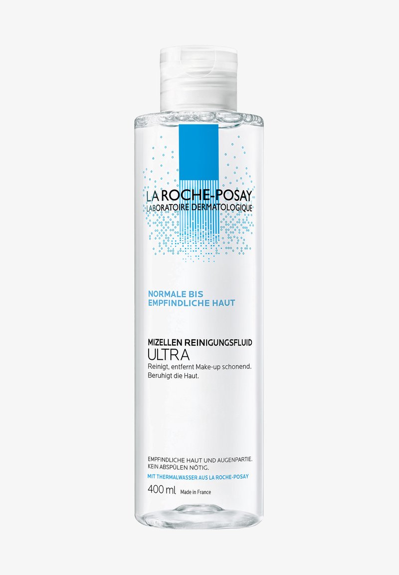 Clear plastic bottle containing 400 ml of micellar cleansing fluid. Label features black text and a blue design, indicating gentle formulation for sensitive skin.