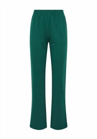 Groene, rekbare loungebroek met een flared leg ontwerp, voorzien van een elastische tailleband en een gladde, zachte textuur.
