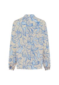 Camicia beige chiara con un motivo floreale blu contornato. Maniche lunghe con polsini elasticizzati e colletto.