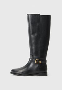 Black leather knee-high boot featuring a gold buckle detail. The design is sleek and elegant, set against a white background.