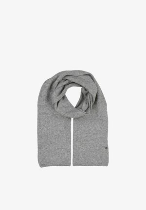 Sciarpa lavorata a maglia di colore grigio chiaro distesa su una superficie piana con un centro ad anello, che mostra la texture e un piccolo logo circolare vicino a un'estremità.