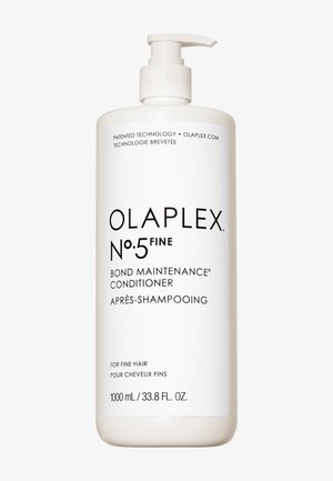 Conditionneur Olaplex N° 5 Fine Bond Maintenance dans une bouteille blanche de 1000 mL avec un bec-pompe, avec un texte noir en gras sur l'étiquette.