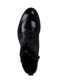 Bottine en cuir noir avec une finition brillante, dotée de lacets, d'un bout arrondi et d'une fermeture éclair sur le côté pour un enfilage et un retrait faciles.