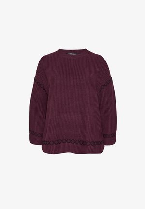 Tummanpunainen neulepaita leveillä hihoilla, jossa on mustat geometriset kuvioinnit helman ja hihansuiden kohdalla. Pyöreä kaula-aukko ja rento malli.