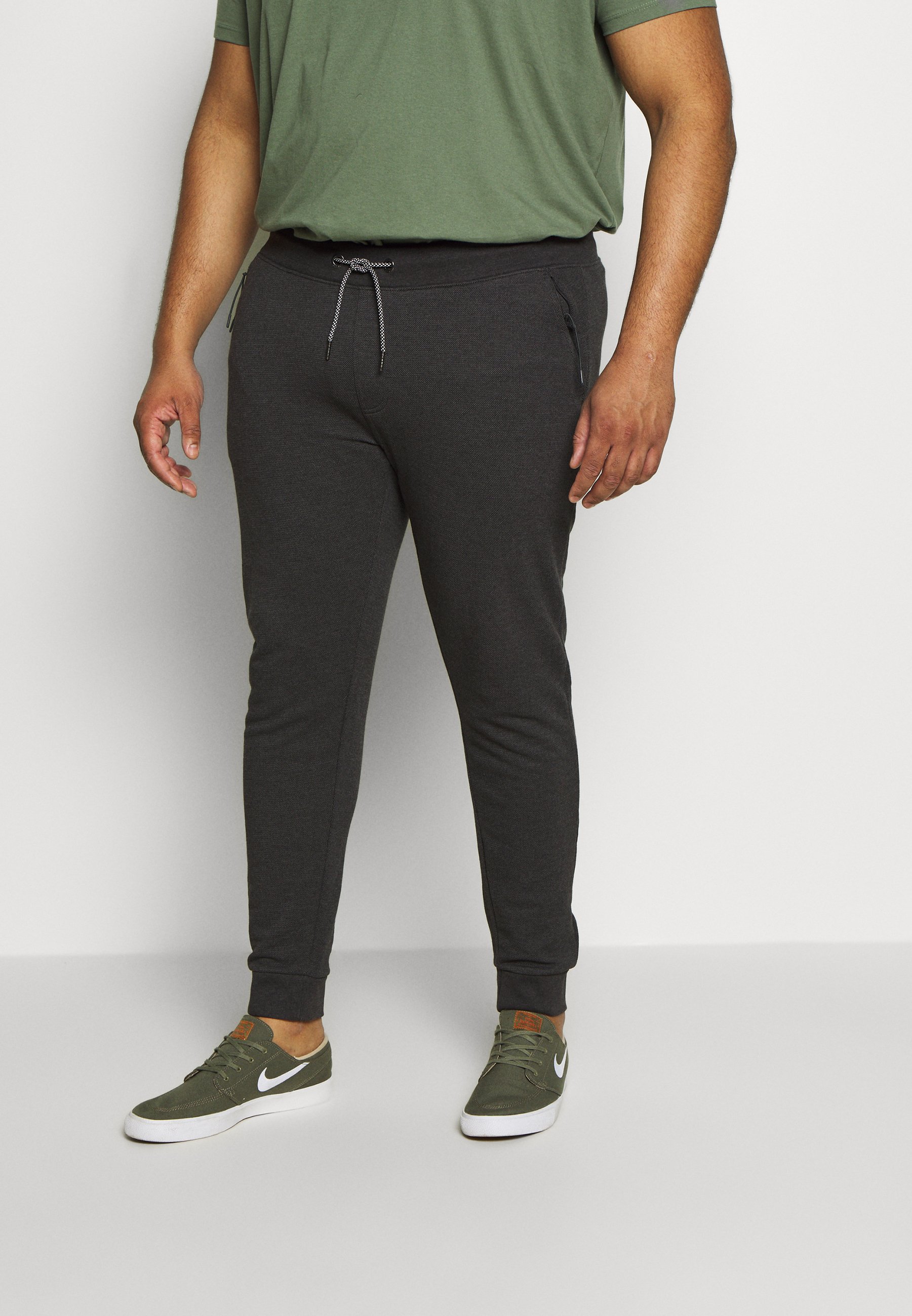 Blend Joggebukse charcoal Zalando.no Russell Athletic Eagle R CUFFED LEG PANT SLIM FIT - Joggebukse - black