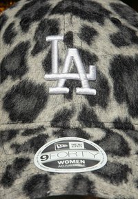 Women's adjustable New Era 9FORTY cap with gray and black leopard print and white embroidered "LA" logo on the front.