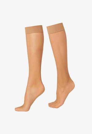 Medias de compresión beige con una textura suave, diseño hasta la rodilla y bandas elásticas acanaladas en la parte superior. Pie cubierto, dedos expuestos.