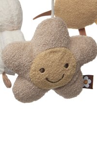 Soft plush star-shaped toy in beige and light brown with a smiling face. Features textured fabric and a small flower tag on the side.