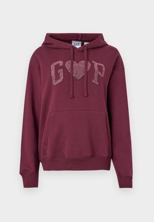 Bordo hoodica s džepom sprijeda, sa sjajnim "GAP" natpisom i srcem u srebrnoj boji. Mekani materijal, opušten kroj.