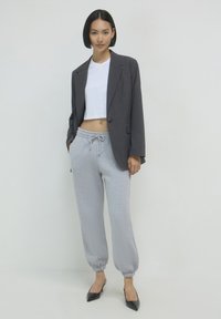 Calliope GINNICO UNITA - Pantaloni sportivi - grigio medio melange