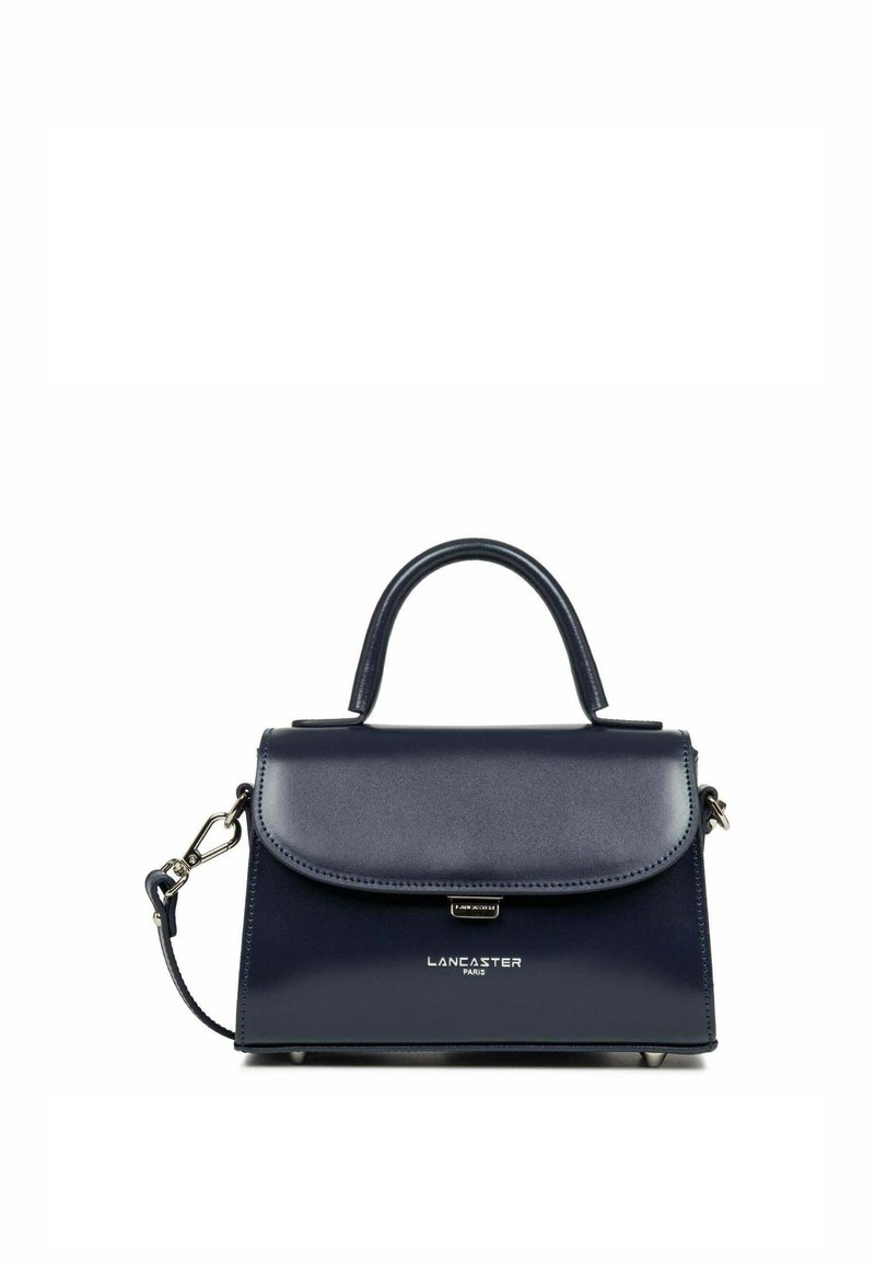 Sac à main en cuir bleu marine avec un design structuré, anse supérieure, bandoulière détachable et détail métallique de la marque à l'avant.
