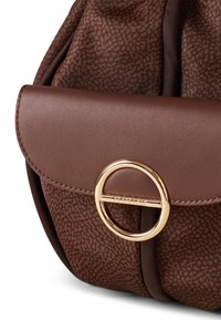 Brown textured leather bag with a rounded shape, featuring a gold circular hardware detail and a patterned textile section.