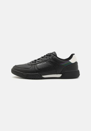 Black athletic shoe with smooth leather upper, textured side panels, white accents, and patterned laces. Prominent logo on side.