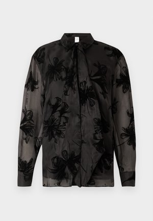 Černá průhledná blůza s květinovým vzorem, s límcem na špičku, dlouhými rukávy a zaobleným lemem. Vyrobená z lehké látky s hladkou texturou.