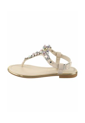 Beige sandal med en dekorativ juveludsmykning på overdelen. Har en tåsnoedesign, rem med spænde og en sål med guldkant.