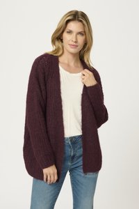 Burgundy knitted cardigan with an open front, loose fit, and ribbed texture. Paired with a white t-shirt and blue jeans.